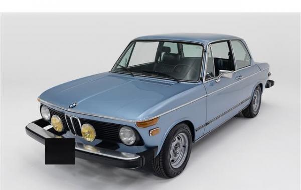 1974 BMW 2002 Tii Fjord Metallic over a blue interior
