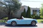 1958 Jaguar XK150 Roadster Blue with red interior