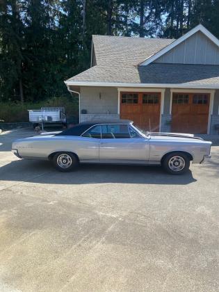 1966 Pontiac Le Mans Silver with black vinyl roof and black stripes